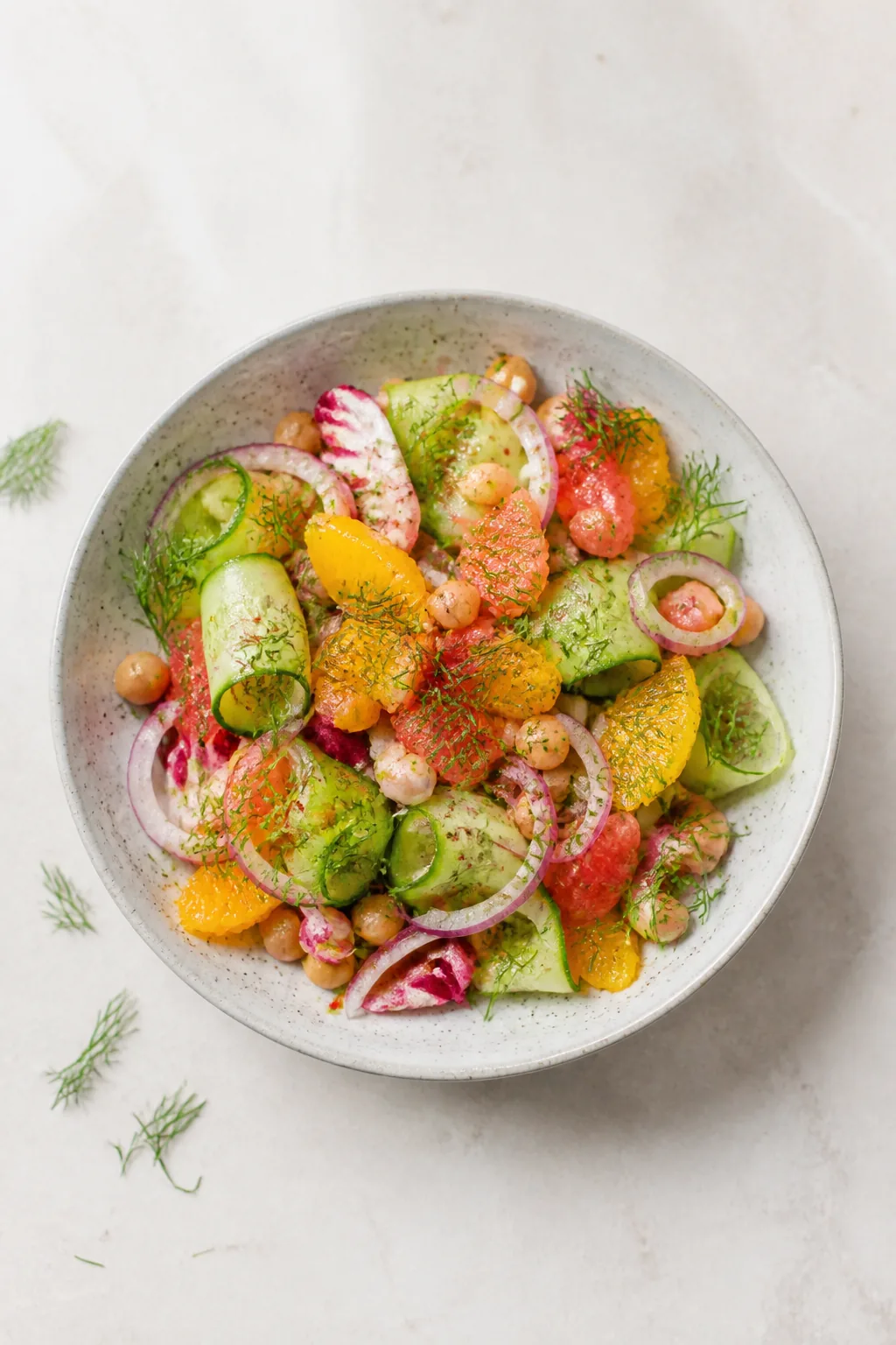 Colorful salad on stoneware